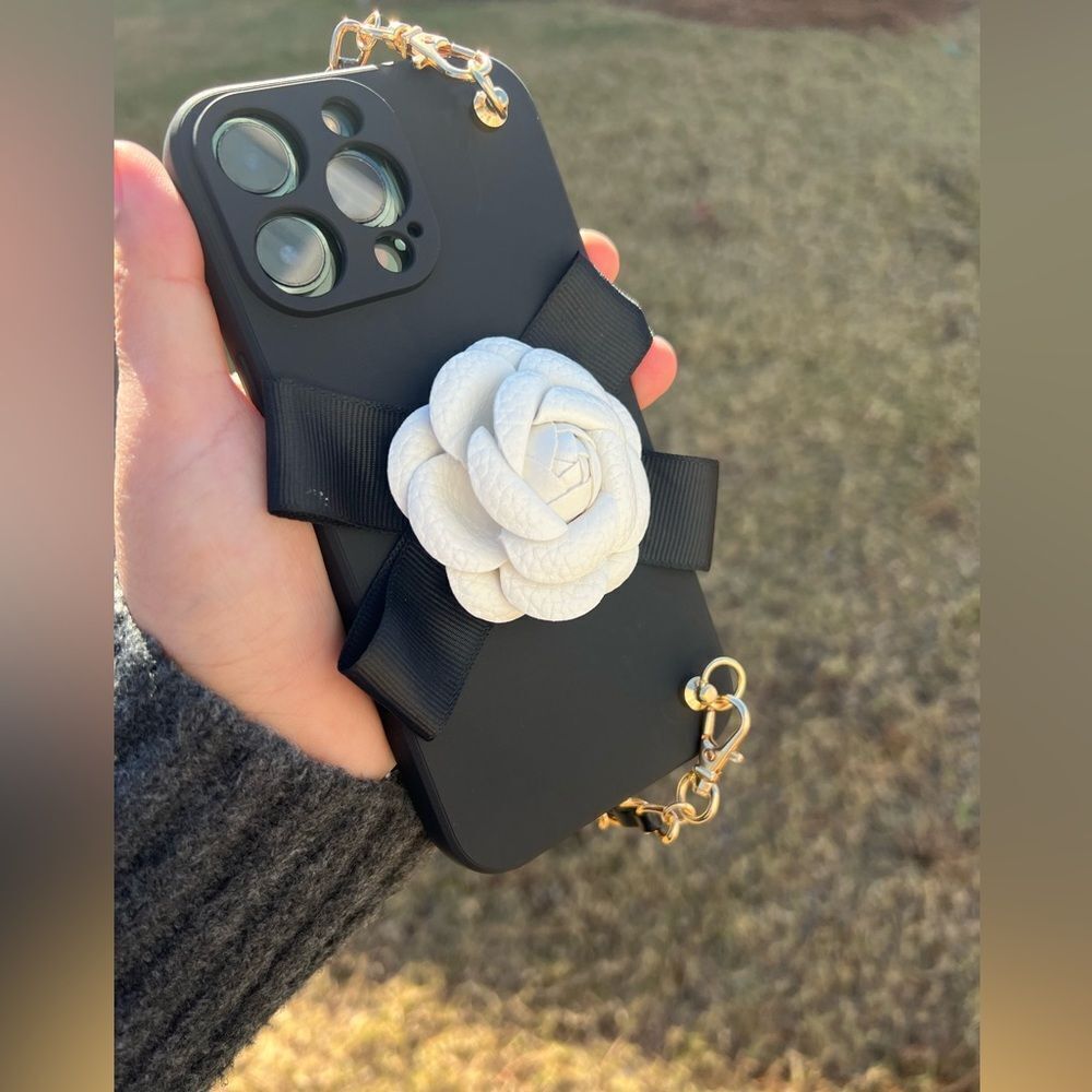 Elegant Chain Strap iPhone 16 Case with White Flower Accent - Picture 9 of 9